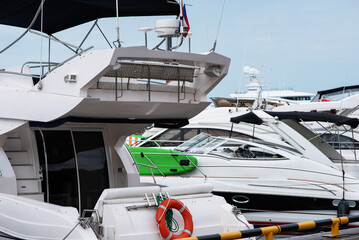 Yacht club and marina long view. Luxurious yacht marina. Yacht parking in harbor, harbor yacht club Beautiful Yachts in blue sky background.