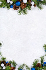 Wall Mural - christmas decoration. blue christmas balls, cones pine, branches christmas tree on snow with space f