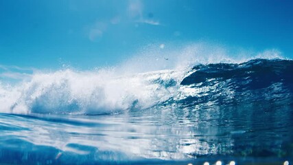 Wall Mural - Ocean wave breaks. Underwater view of a surfing spot in the Maldives