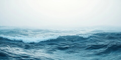 Wall Mural - A serene view of ocean waves gently rolling under a cloudy sky.