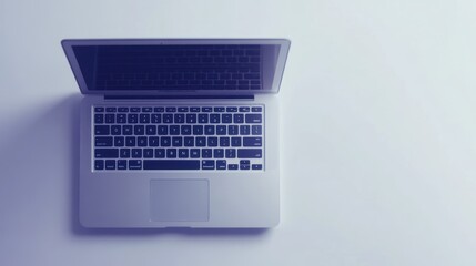 Poster - A Silver Laptop Computer Sits On A White Surface