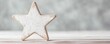 © PromptrGuru - White wooden star decoration on light wooden surface against soft gray background. Minimalist rustic decor with copy space. Clean simple design perfect for holiday or review rating. 8k banner