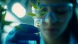 © rehan - Scientist Holds Young Plant In Test Tube During Experiment