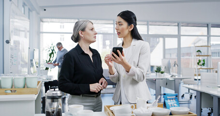 Poster - Business women, coffee break and mobile phone with email, news and conversation as employee. Female people, technology and gossip for lunch, hot beverage and social media in accounting firm or office