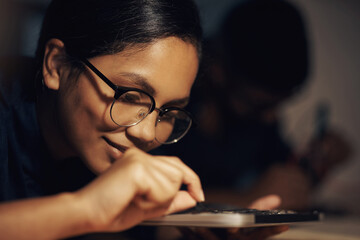 Poster - Woman, electronics and technician on motherboard at night, repair circuit hardware in workplace. Female person, configure processor and maintenance of cpu system, tech support and assemble machine