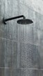 © olegganko - Modern shower head with sleek design and flowing water in contemporary bathroom setting