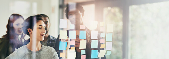 Leinwandbilder - Idea, window and business people in meeting in office for brainstorming, discussion and planning. Creative company, banner and men and women with sticky notes for teamwork, research and project