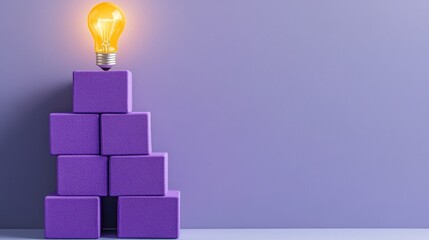 Poster - Purple blocks forming a pyramid with a lit bulb above, representing progress and learning growth