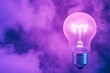 © ratatosk - Glowing purple light bulb on dark background. Creative thinking concept. Technology startup and business idea. Problem solving. Energy solution