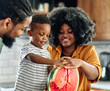 © Lumos sp - child family kitchen food boy son father mother watermelon fruit slice summer organic meal fun preparing healthy diet eating home black
