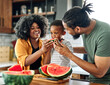 © Lumos sp - child family kitchen food boy son father mother watermelon fruit slice summer organic meal fun preparing healthy diet eating home black