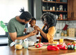 © Lumos sp - child family kitchen boy son mother father drink breakfast milk healthy drinking food eating glass home black african american father man together love cute childhood