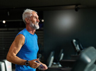 gym sport fitness exercising training mature man running cardio treadmill healthy active adult mid a