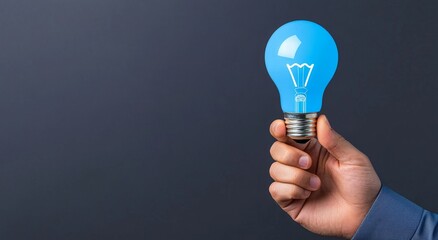 Poster - A businessman with a glowing lightbulb represents creative ideas and innovation.