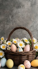 Wall Mural - A wicker basket filled with pastel-colored Easter eggs sits on a wooden table. Surrounding the eggs are fresh blooming branches and green grass accents, celebrating springtime