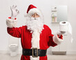 © Ljupco Smokovski - Santa claus holding a toilet paper roll and gesturing good sign in a bathroom
