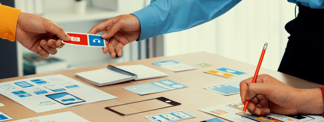Poster - panorama banner of startup company employee planning on user interface prototype for mobile applicat