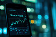 © Matija - Smartphone with Stock Picks Chart Display