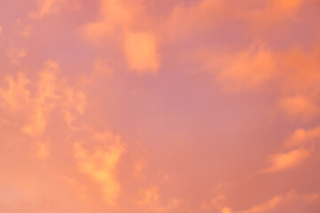 Wall Mural - a beautiful sky tinted by the sun leaving vibrant shades of gold, pink, blue and multicolored. cloud