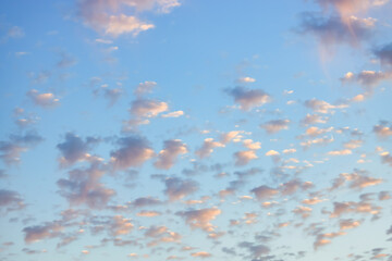 Wall Mural - a beautiful sky tinted by the sun leaving vibrant shades of gold, pink, blue and multicolored. cloud