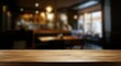 © MD. NADIM MAHMUD - Wooden board empty table in front of blurred background Mockup restaurants
