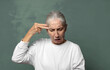 © kues1 - looking unhappy and stressed, suicide gesture making gun sign with hand, pointing to head
