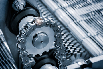 Aufkleber - Gear chain drive shaft in conveyor belt is on production line. Timing chain of car, tensioners in engine. Industrial roller chain, technology. Team work, business industrial concept