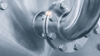 Poster - Dairy machine cooling radiator with a row of stainless steel metal pipes with silver trim. The pipes are connected to each other and appear to be part of a larger system