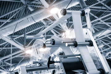Poster - Fragment of the conveyor of sticking labeling machine. Abstract industrial background.