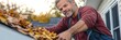 © Eva - Middle-Aged Man Cleaning Fallen Autumn Leaves Off His Roof, Home Maintenance in Autumn Season