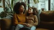 © Lion - Mother and daughter sitting on couch, sharing a relaxed moment in a cozy living room, warm natural lighting, family bonding,