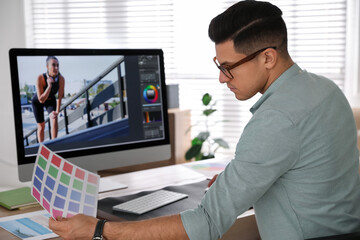 Poster - Professional retoucher working on computer in office