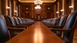 © Pisan - A polished wooden table stretches through an elegant courtroom, lined with dark chairs, showcasing a formal and historic atmosphere.