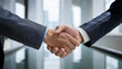 © H.J___96 - A photo highlighting a business handshake in the background of the office