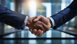 © H.J___96 - A photo highlighting a business handshake in the background of the office