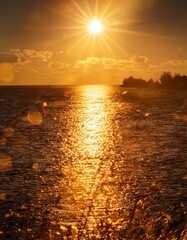 Canvas Print - Golden hour sunset over calm water.  Warm tones paint the sky and sea.