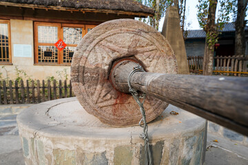 Wall Mural - stone roller, Daur Village, China Ethnic Museum, Beijing.