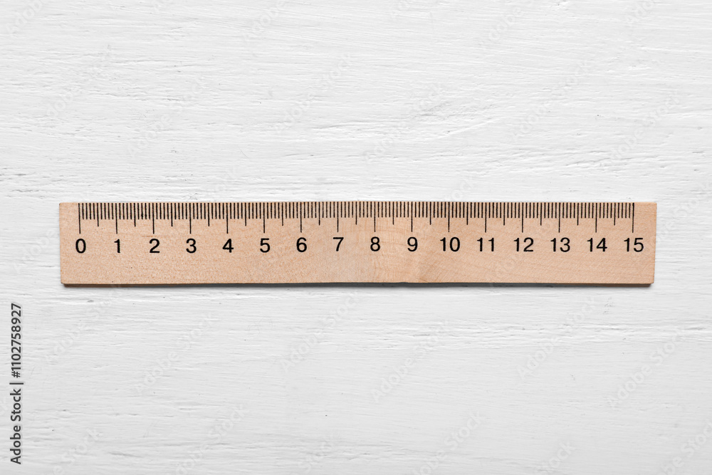 Ruler on light wooden background