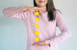 © natara - Woman is holding up five stars in her hands, Representing rating, Quality service, and positive customer feedback.