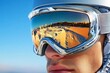 © Sanchai - A close-up of a pair of ski goggles reflecting the slopes of Bjelasnica and the bright winter sun