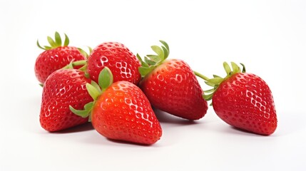 Wall Mural - Fresh ripe strawberries arranged on a clean white background showcasing their vibrant red color and green leaves for culinary presentations.