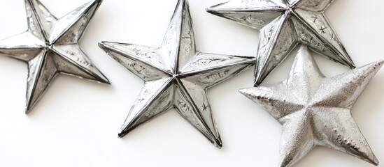 Poster - Silver Christmas stars elegantly arranged on a pristine white background capturing a festive and modern holiday spirit.