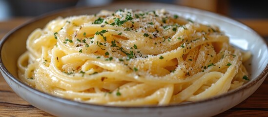 Fototapete - Creamy and savory spaghetti dish topped with Parmesan and herbs in a rustic bowl on a wooden table