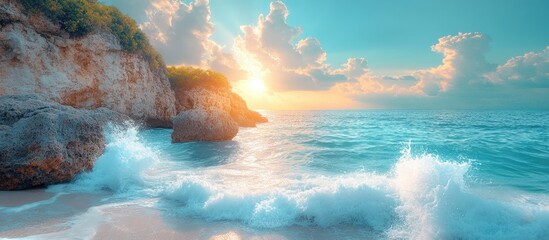 Poster - Serene coastal landscape featuring turquoise waves crashing on rugged grey rocks under a radiant sunlit sky