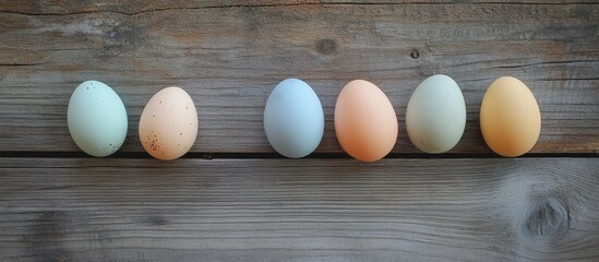 Aufkleber - Easter eggs in pastel colors arranged on rustic wooden planks for festive spring decor or seasonal celebrations