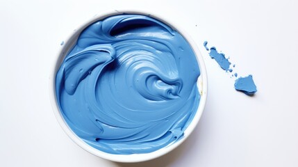 Aufkleber - Blue foamy modeling paste in a white bowl on a clean surface showcasing its smooth, creamy texture for creative projects and crafts.