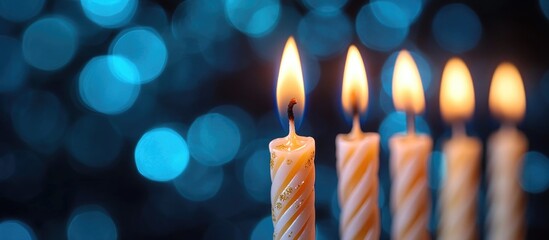 Poster - Fifteen lit birthday candles on a vibrant blue bokeh background celebrating a joyful special occasion and festive atmosphere.