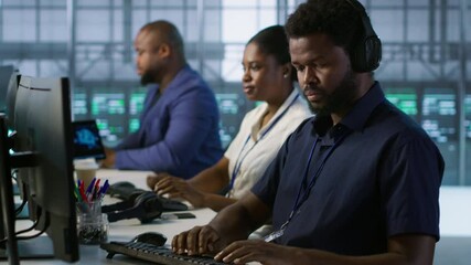 Poster - data center admin typing on keyboard, maintaining company network infrastructure by configuring hard