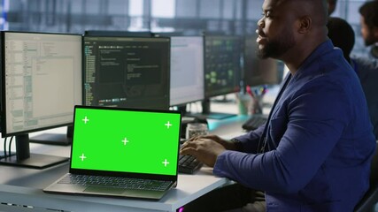 Poster - data center technician using chroma key laptop, maintaining company network infrastructure. server h