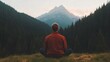 © Alexey - Tranquil moment of solitude at mountain peak sunrise. Seated man in orange sweater overlooking majestic mountain landscape with evergreen forest vista. Mindfulness and nature concept with copy space